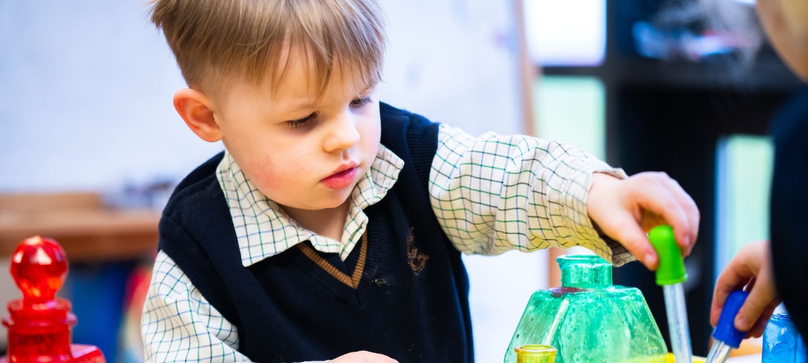 Embley pre-school pupil playing with toys